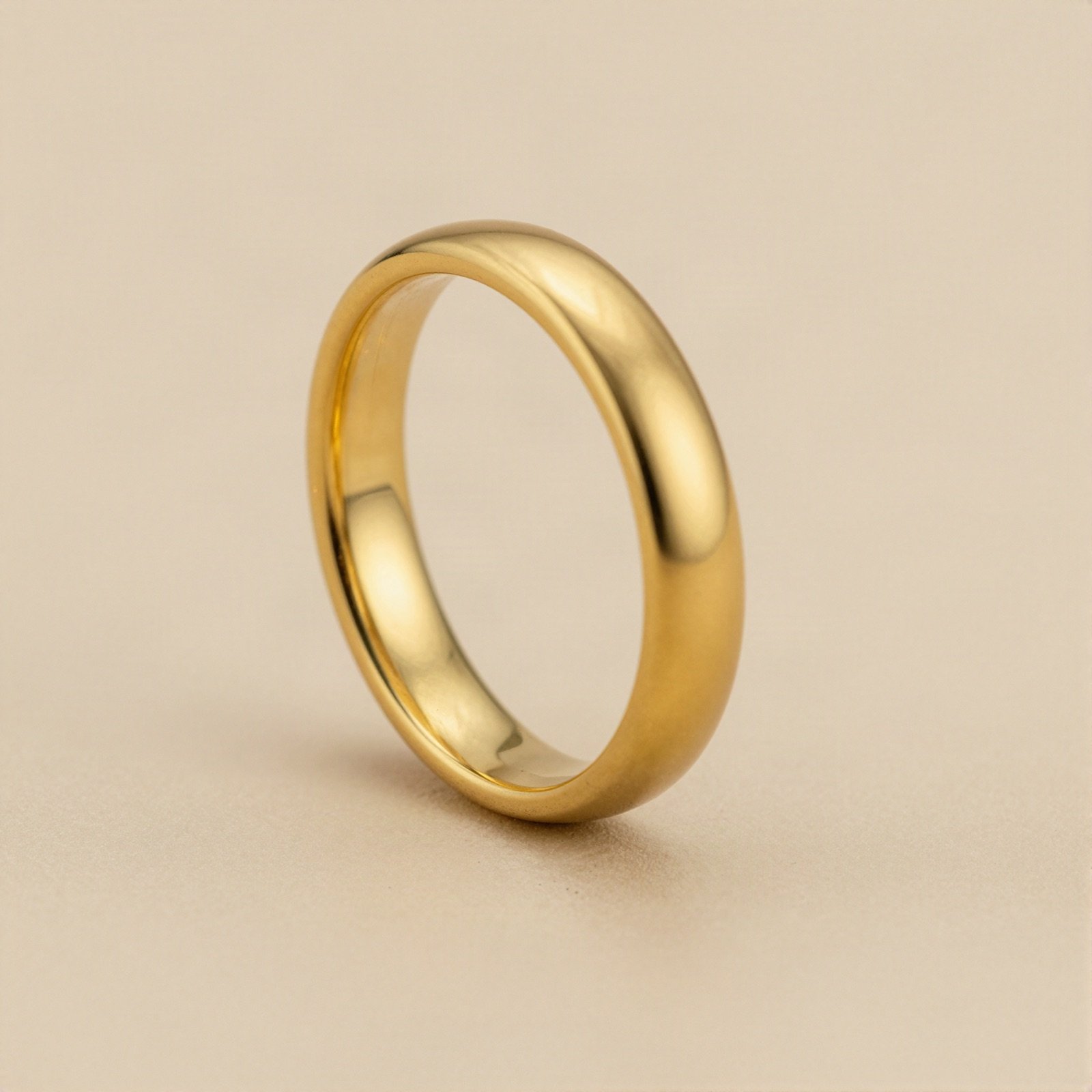 A classic polished yellow gold wedding band
